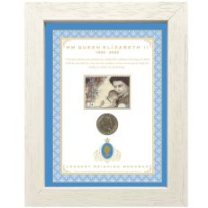 White and blue framed set of coin and stamp of Queen Elizabeth II